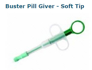A green and clear plastic pill dispenser with a soft tip and finger grips, designed for administering medication to pets.