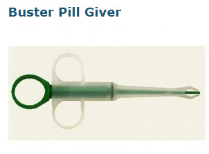 A plastic Buster Pill Giver tool with finger grips and a long narrow tip, designed to administer pills to pets.